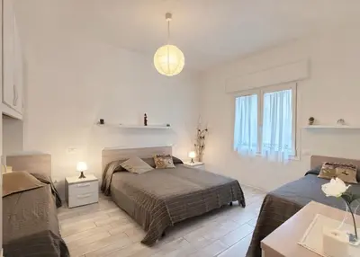 Letto o letti in una camera di Villa Nadia - Carraro Immobiliare - Family Apartments