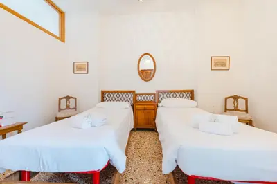 Letto o letti in una camera di Casa Flavia