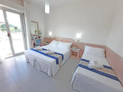 Letto o letti in una camera di Hotel Margherita
