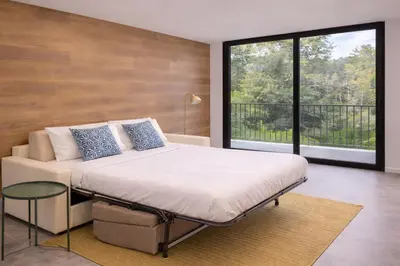 Letto o letti in una camera di Residence Domus 1 - Treviso Family Suites