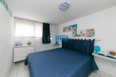 Letto o letti in una camera di Condominio Torino