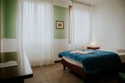 Letto o letti in una camera di Casa Accademia