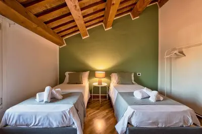 Letto o letti in una camera di Il Mosaico, 3BR,2BA in the Heart of Vicenza