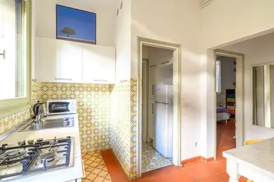 Cucina o angolo cottura di GuestHost - Torre dell'Orologio Apartment Padova