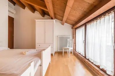 Letto o letti in una camera di GuestHost - Fascino Veneziano a Cannaregio