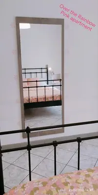 Letto o letti in una camera di APPARTAMENTO ROSA OVER THE RAINBOW APARTMENTS Lido di Jesolo
