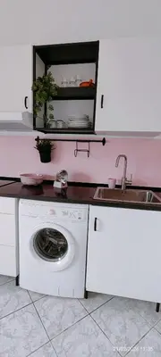 Cucina o angolo cottura di APPARTAMENTO ROSA OVER THE RAINBOW APARTMENTS Lido di Jesolo
