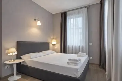 Letto o letti in una camera di Hotiday Treviso Cadorna