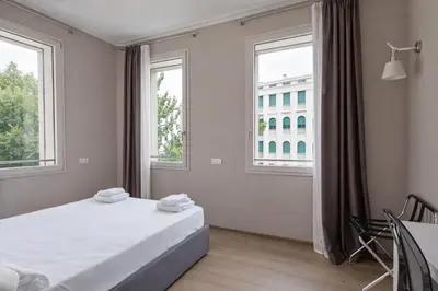 Letto o letti in una camera di Hotiday Treviso Cadorna