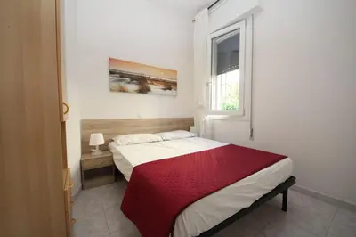 Letto o letti in una camera di Cozy flat with garden