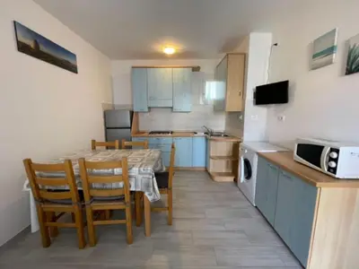 Cucina o angolo cottura di Welcoming apartment for families in Rosolina Mare
