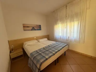 Letto o letti in una camera di Cozy flat with private parking in Rosolina Mare