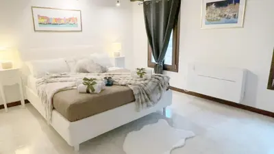 Letto o letti in una camera di Appartamento Ca’De la Madonna by Ca-Sa Check