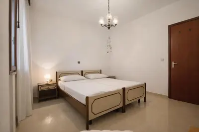 Letto o letti in una camera di Vespucci House Appartamento vicino alla Spiaggia con Aria Condizionata e Parcheggio Gratuito