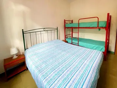 Letto o letti in una camera di Family Retreat in Via delle Campanule