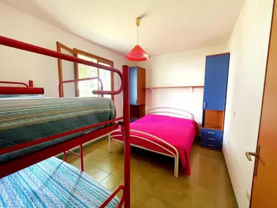 Letto o letti in una camera di Holiday Getaway for 5 near the Beach