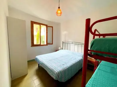 Letto o letti in una camera di Via delle Campanule Apartment for 5
