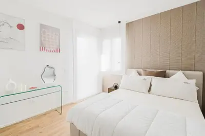 Letto o letti in una camera di Jesolo Altamarea The Level Suite