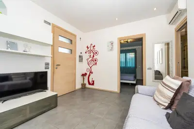 TV o dispositivi per l'intrattenimento presso Myriam Holiday Apartment - Realnova