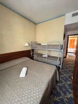 Letto o letti in una camera di Affitta Camere Padova