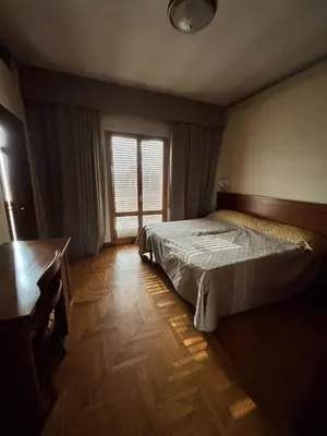 Letto o letti in una camera di Affitta Camere Padova