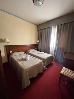 Letto o letti in una camera di Affitta Camere Padova