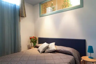 Letto o letti in una camera di PadovaResidence Apartments - tra Piazza delle Erbe e il Duomo