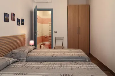 Letto o letti in una camera di PadovaResidence Apartments - vicino Cappella degli Scrovegni e Ospedale