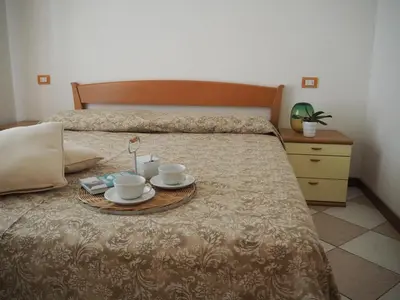 Letto o letti in una camera di Family Apartments Residence Trieste
