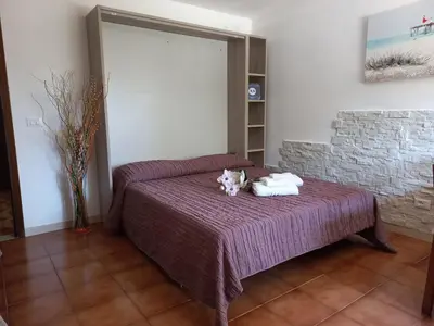 Letto o letti in una camera di Appartamento Le Magnolie