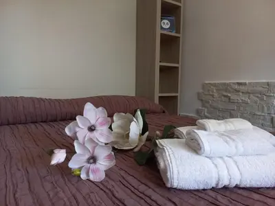 Letto o letti in una camera di Appartamento Le Magnolie