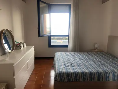 Letto o letti in una camera di RESIDENCE PENELOPE - WALTERIGATO Apartments SOLO PER FAMIGLIE