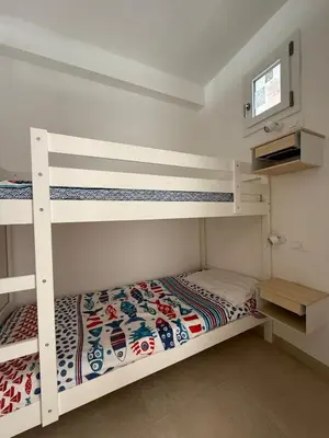 Letto o letti in una camera di RESIDENCE GARDEN -WALTERIGATO Apartments SOLO PER FAMIGLIE