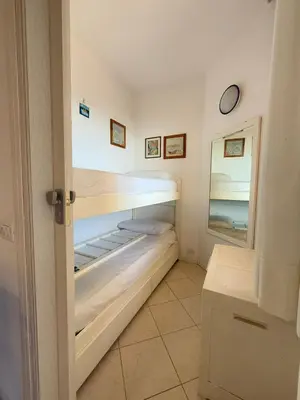 Letto o letti in una camera di RESIDENCE APOLLO - WALTERIGATO Apartments SOLO PER FAMIGLIE
