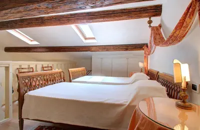 Letto o letti in una camera di MOCENIGO~CanalGrande aperitif