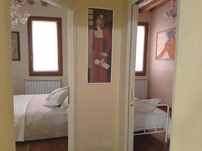 Letto o letti in una camera di Domus Dea