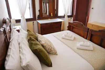 Letto o letti in una camera di Ca' Alle Gondolette by Sarlux