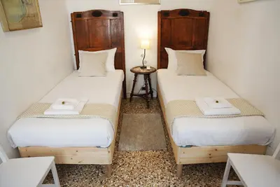 Letto o letti in una camera di Ca' Alle Gondolette by Sarlux