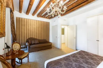 Letto o letti in una camera di San Teodoro Palace - Luxury Apartments
