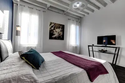 Letto o letti in una camera di Biennale Superior Suite by Wonderful Italy
