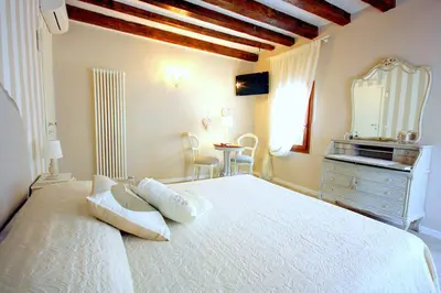 Letto o letti in una camera di Terrazza Biennale