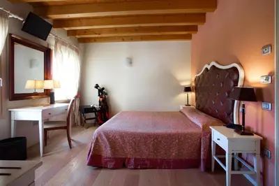 Letto o letti in una camera di Hotel Asolo