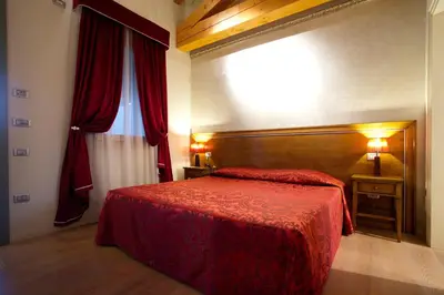 Letto o letti in una camera di Hotel Asolo