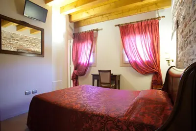 Letto o letti in una camera di Hotel Asolo
