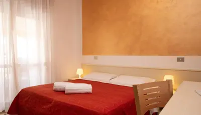 Letto o letti in una camera di Hotel Nazionale