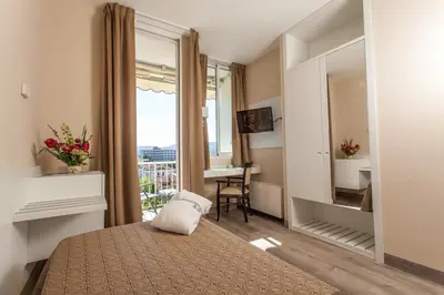 Letto o letti in una camera di Hotel Abano Astoria