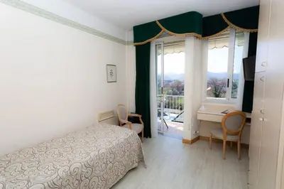Letto o letti in una camera di Hotel Abano Astoria