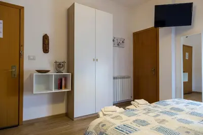 Letto o letti in una camera di Albergo Felice
