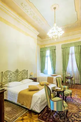 Letto o letti in una camera di Villa Ducale Hotel & Ristorante