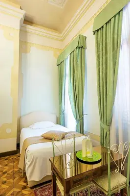 Letto o letti in una camera di Villa Ducale Hotel & Ristorante
